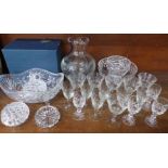 Assorted glassware including a large vase and wine