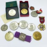 Medallions including one silver and enamel and a buckle