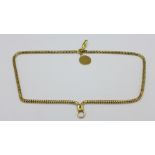 An 18ct gold bracelet with a small 9ct gold fob, total weight 17.