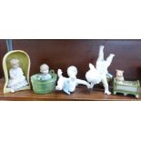 Two piano baby figures, a bisque figure and two other continental figures,