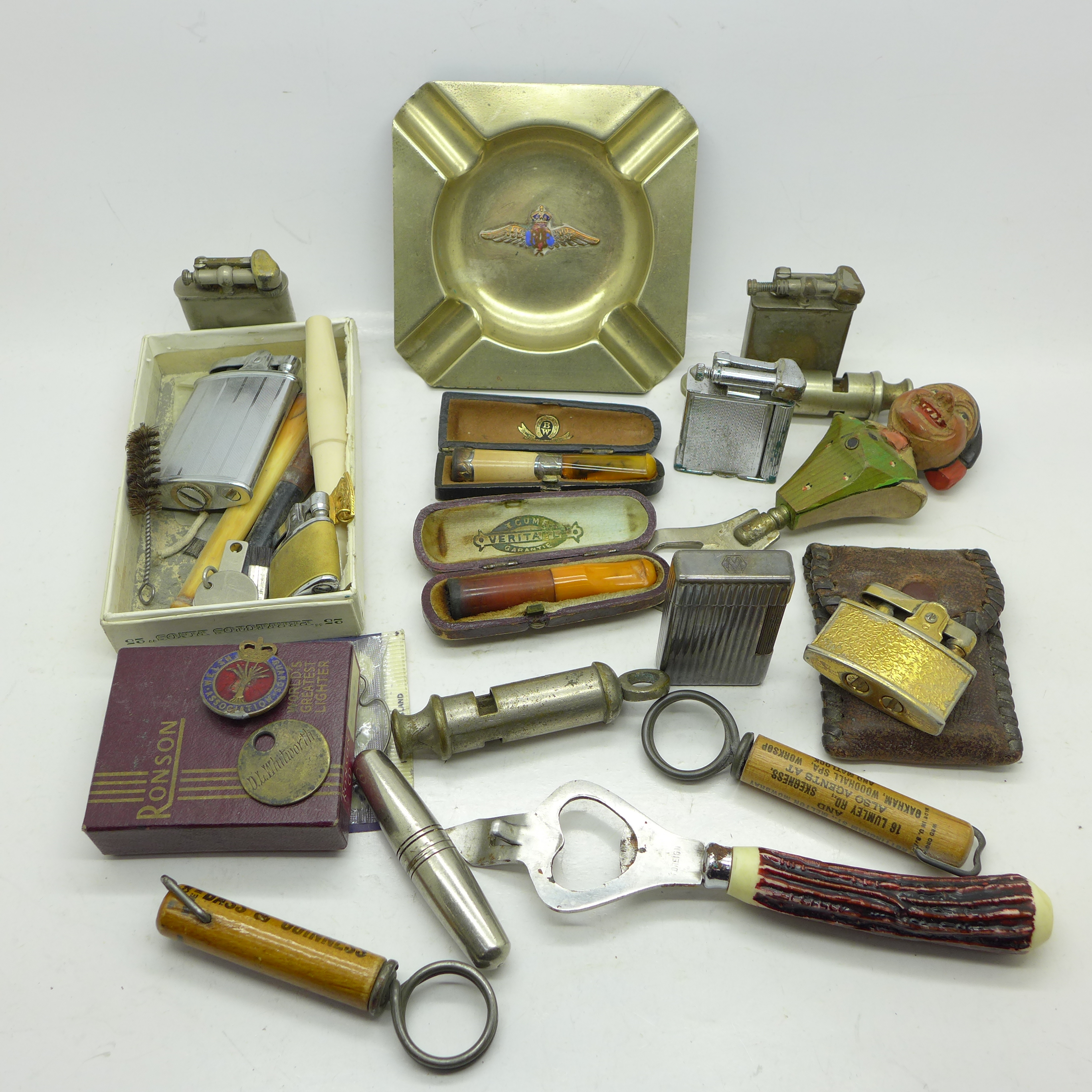 Lighters including a Dunhill, an ashtray with RAF logo, bottle openers,