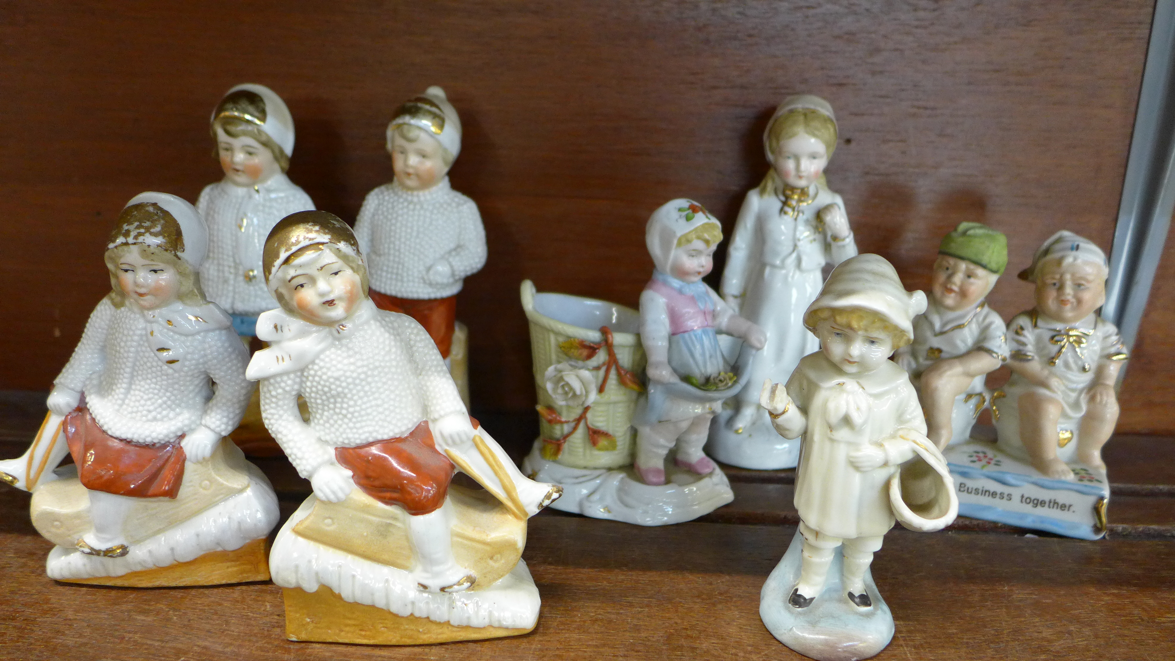 Two pairs of 'snow' children, one marked Germany and four other Victorian continental figures,