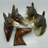Four ceramic horse's head wall plaques including Jema,