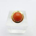 A coral set ring with continental control marks,