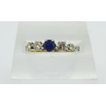 An 18ct gold, sapphire and diamond five stone ring, 2.