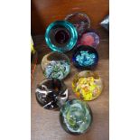 Eight glass paperweights including Caithness,