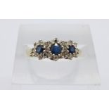 A 9ct gold, triple cluster sapphire and diamond ring, 2.