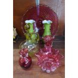 Two green glass vases, three items of cranberry glass, a glass decanter and a bowl,