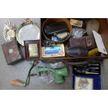 A case of assorted items including a barbola mirror, a drawing set, brushes, a mincer, etc.