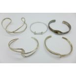 Five silver bangles,