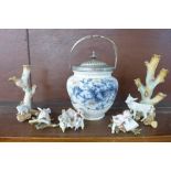 A biscuit barrel, two continental posy vases, one with staple repair, a pair of cherub figures, a/f,