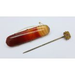 A 9ct gold and agate brooch and a pin set with a ruby