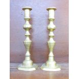 A pair of brass candlesticks,