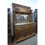 A 19th Century Flemish carved oak mirrorback sideboard