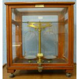 A set of mahogany cased Oertling chemical balance scales