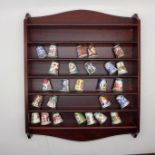 A collection of Royal Worcester thimbles with display rack