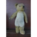 A Merrythought Teddy bear with a button on the back marked Hygienic Merrythought Toys,