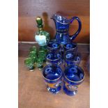 A blue glass lemonade set and a green glass liqueur set