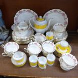 A twelve setting Royal Staffordshire tea service and a six setting coffee service with coffee pot,