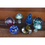 Seven glass paperweights including two Caithness