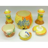 A Clarice Cliff Bizarre three piece cruet, salt a/f, a honey pot base and a honey pot lid, lid a/f,