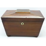 A mahogany sarcophagus shaped tea caddy