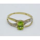 A 9ct gold, peridot and diamond ring, 0.