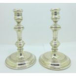 A pair of silver candlesticks, 16.