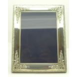 A silver photograph frame, 22.5cm x 17.