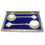 A pair of plated spoons,