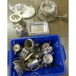 A box of silver plated items, candlesticks, tray, serving dishes, tea caddy, etc.