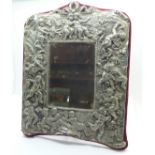 A sterling silver mirror with cherubs,