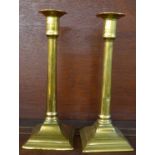 A pair of brass candlesticks