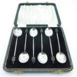 A cased set of six silver coffee spoons,