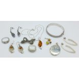 A collection of silver jewellery including a hallmarked locket and bangle