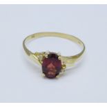 A 9ct gold, garnet and diamond ring, 1.