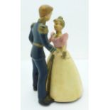 A 1950's clockwork toy of Cinderella and Prince Charming