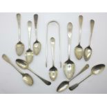 A collection of silver spoons and sugar bows,