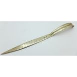 A silver letter opener with inscription to Cmdr.