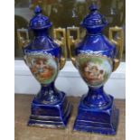 A pair of blue vases and covers, marked Royal Warwick, 33.