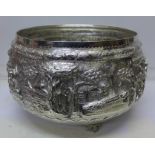 A large Eastern embossed white metal bowl,