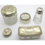 A collection of silver topped glass jars