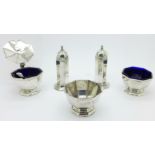 A five piece silver condiment set, lacking one blue glass liner, two liners a/f,