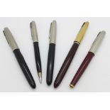 A Parker pen set and three other Parker fountain pens,