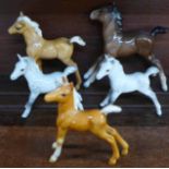Five model Beswick horses including model 1084 foal designed by Arthur Gredington,