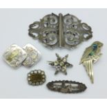 A silver buckle and five brooches including two with Victorian silver hallmarks