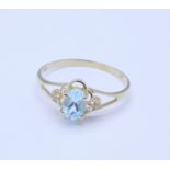 A 9ct gold, aquamarine and diamond ring, 1g,