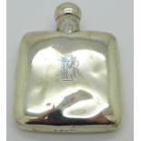 A silver hip flask,