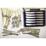 A cased set of six silver handled butter knives and two other sets of silver handled knives and