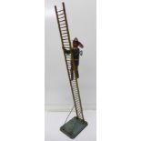 A tinplate clockwork Climbing Fireman toy by Marx UK,